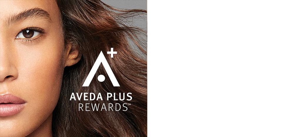 AVEDA PLUS REWARDS logo overlayed on image of Aveda hair care model.