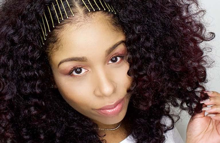 Previously approved Aveda Artist UGC image of volumized curls with clips from @aveda.