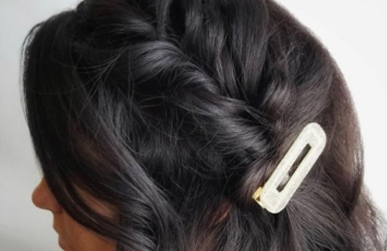 Previously approved Aveda Artist UGC image of volumized curls with clips from @aveda.