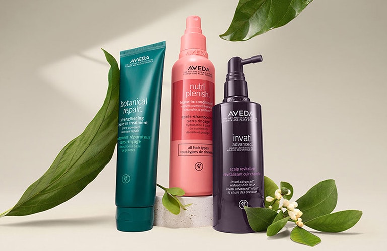 Hero product shot of botanical repair™ strengthening leave-in treatment, nutriplenish™ leave-in conditioner and invati advanced™