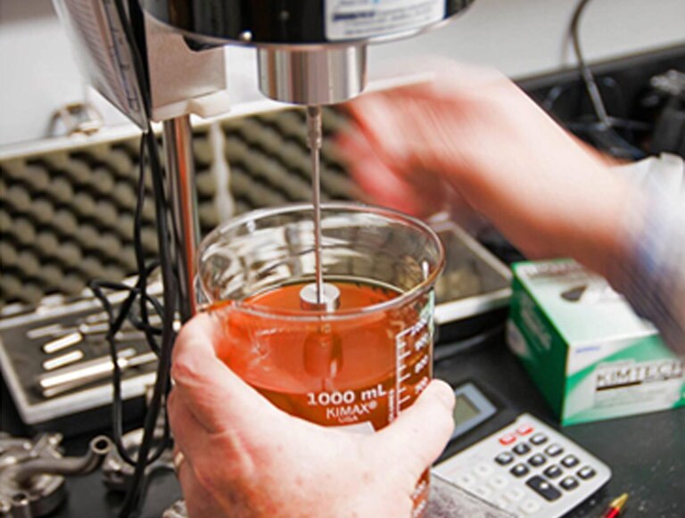 Scientist creating a formula in a lab.
