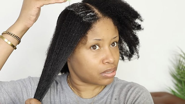 TheChicNatural applying product to hair