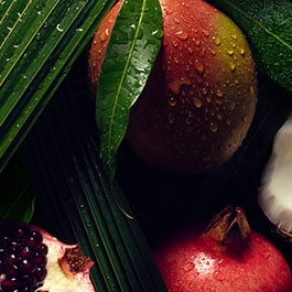 green ingredients layerd onto a black plate on top of a dark background